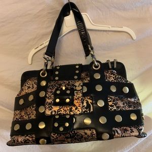 Elite style is yours with this ultra embellished studs paisley lustrous Handbag